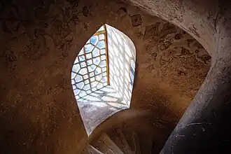 Wooden windows on one of the spiral staircases of Ali Qapu Palace