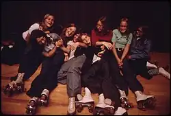 A group of teenagers pose at Izzy-Dorry's Roller Rink in New Ulm, Minnesota, 1974