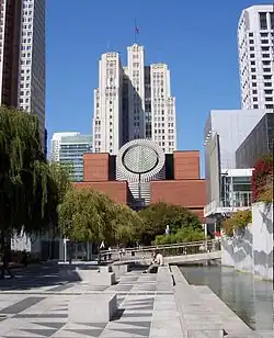 The building as seen from Yerba Buena Gardens, rising behind the San Francisco Museum of Modern Art