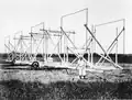 Karl Jansky and his rotating directional radio antenna (1932) in Holmdel, New Jersey, which was the world's first radio telescope, discovering radio emissions from the Milky Way.