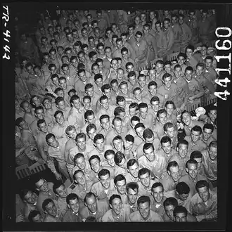 Young men training at pre-flight school at Del Monte Hotel, Del Monte, Calif., grin as they file out of the mess hall. [July 1943][10]
