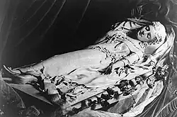 sculpture of a supine woman