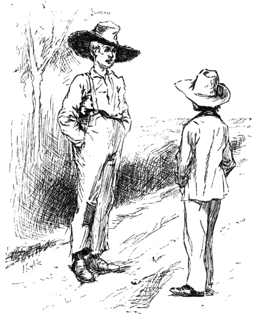 man and boy standing in road talking