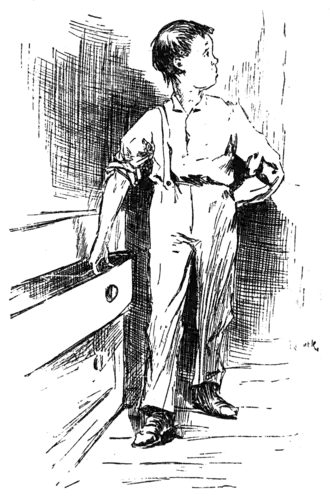 boy looking over his shoulder while reaching into drawer