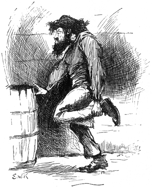 man standing clutching his ankle