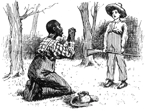 man crouching on ground, talking to boy