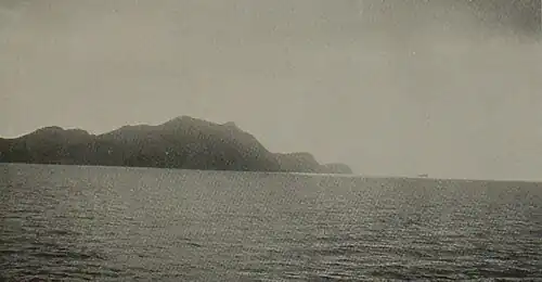 This picture shows seashore of hills as seen off Chi-Fu Harbor, China west of Seoul, Korea.