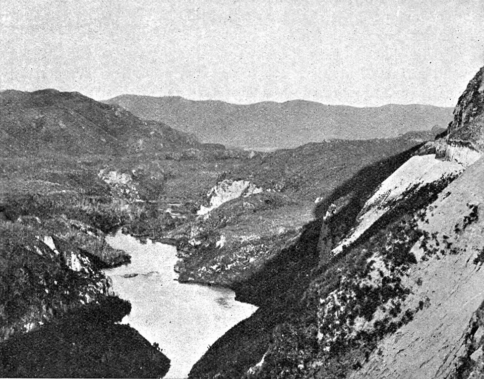 Barren, hilly landscape with more hills further in the background