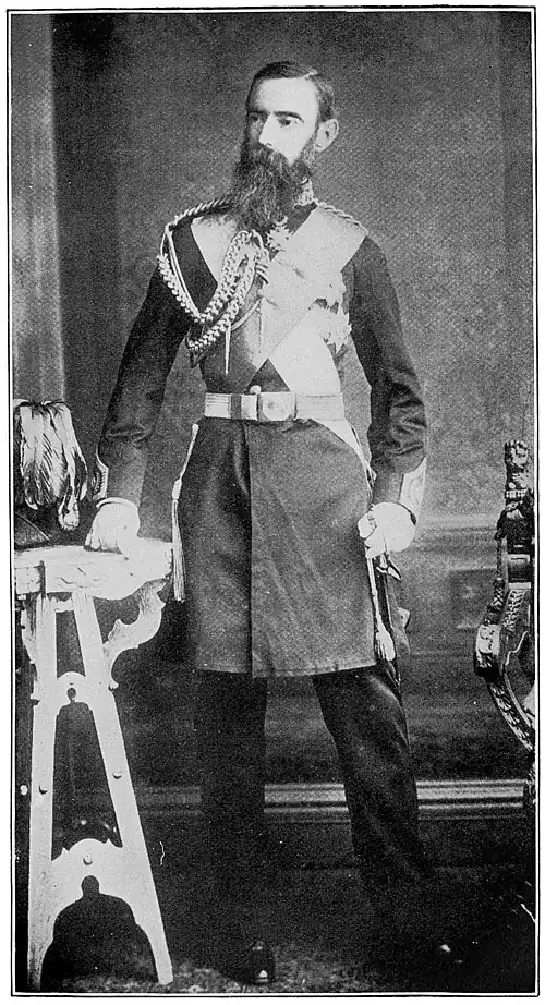 A man standing with ornate military gear