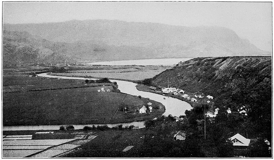 A river snaking around some rolling hills