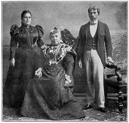 Three persons wearing formal wear