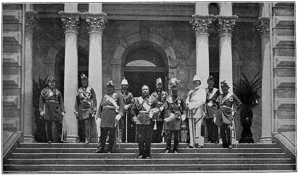 A group of men standing in front of a large building, wearing ornate military outfits