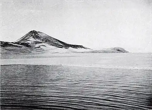 Photo of a distant headland with a hill
