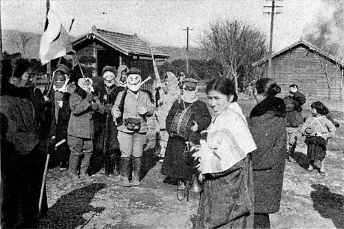 Hamlet women masquerading as men to greet a returned traveler.