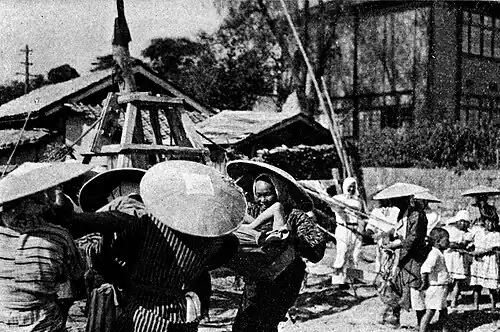 A Group of Women Bouncing a Man They Rushed between Spells of Foundation Pounding.