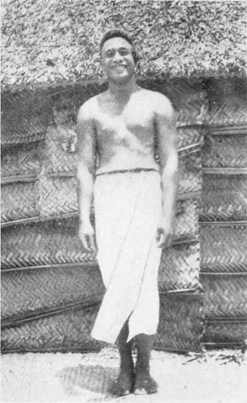 A photo of a man standing and smiling