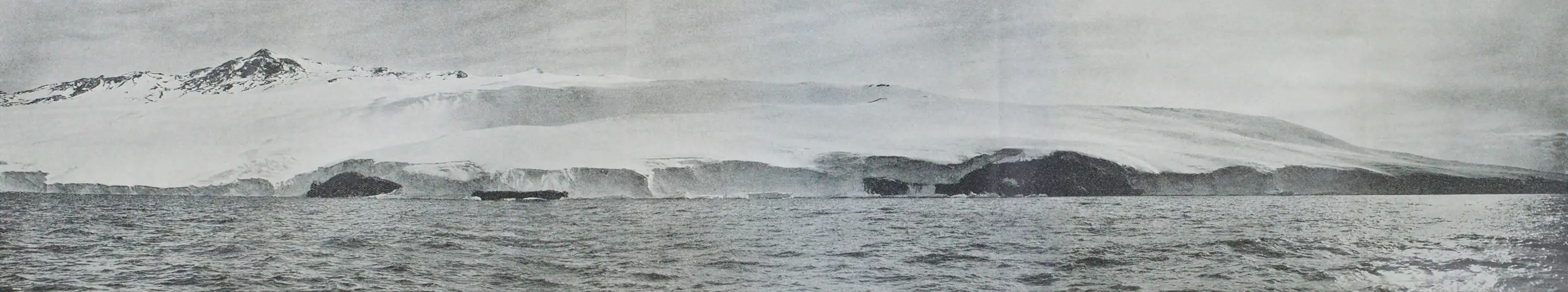 Fold-out panoramic photo of a mountain with a broad flank of ice