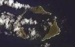 Satellite photograph of the northern islands: green islands in the blue sea, partly obscured by clouds.