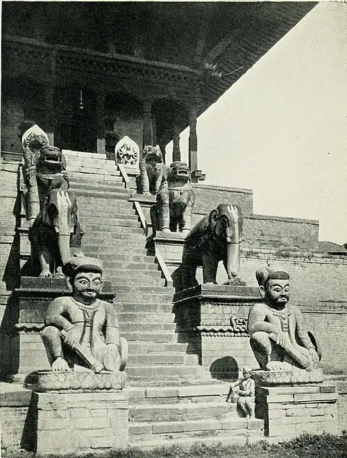 Black and white photograph of the steps of the Nyatpola Deval, or the Temple of the Five Stages, at Bhatgaon.