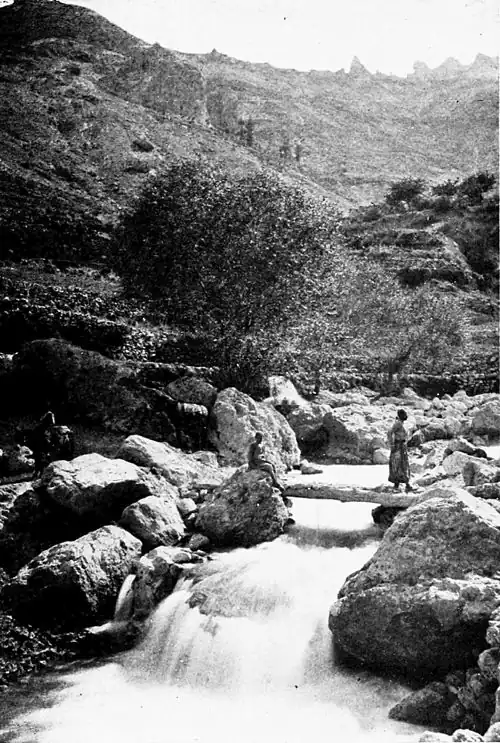The source of the Kadisha River. The rocks in the background mark the edge of the plateau on which are situated the Cedars of Lebanon