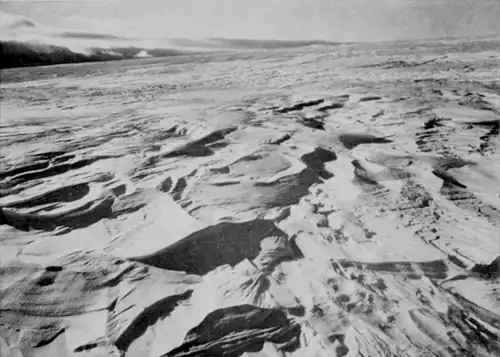 A series of long, wavelike ridges or grooves formed on a snow surface; dunes of snow