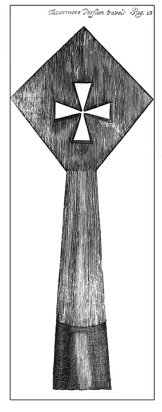 Engraving of a diamond shape with a cross pattée, surmounting a tapering base