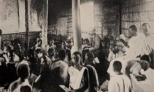 A large group of boys, many with Bibles