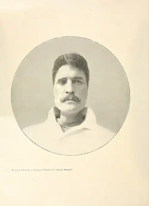 Bust photograph in circular vignette.