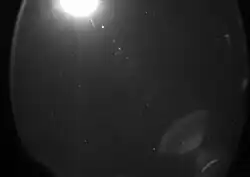 The Moon at upper left and Lens flare