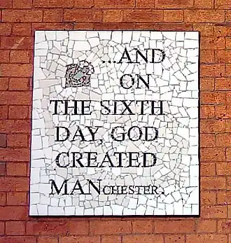 A mosaic in Manchester that says '... And on the sixth day, God created Manchester'