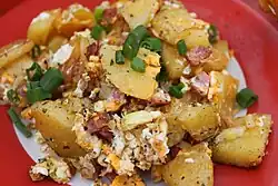 fried dumplings with egg and diced sausage