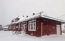 The Beaconsfield railway station is a red painted, historic building with a plant-based café inside. It is on the EXO Line 11 to Vaudreuil/Hudson.